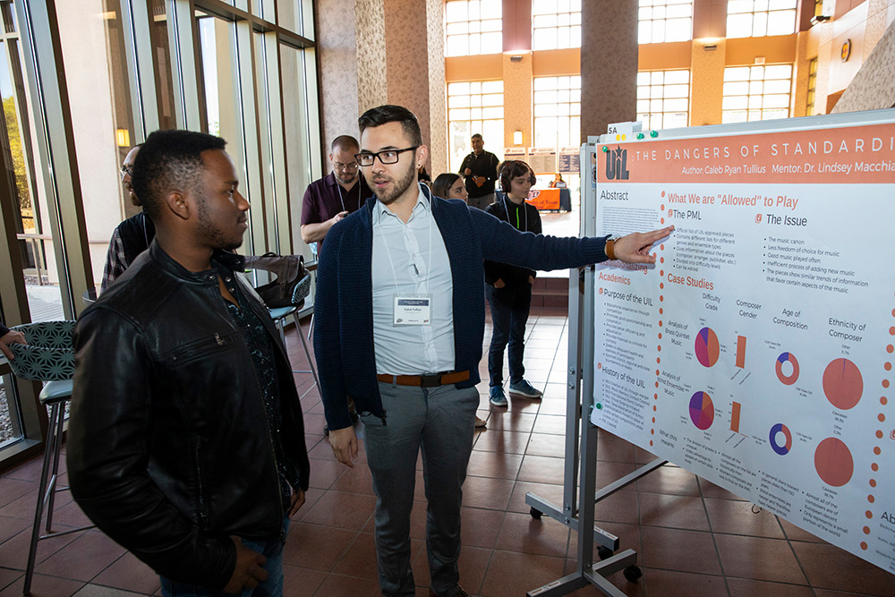 Caleb Tullius, a senior music education major, presents his research at the 2019 Campus Office of Undergraduate Research Initiatives (COURI) Spring Symposium on April 13, 2019. His project looked into the effects of the rules that govern the selection of music that can be played during musical competitions at public schools in Texas. Photo by Ivan Pierre Aguirre / UTEP Communications 