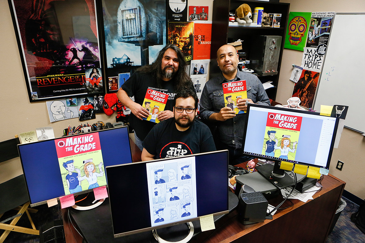 Steve Varela, associate director of Academic Technologies (AT), from left, Adrian Meza, AT instructional technologist, and Mitsu Overstreet, AT art director, created a comic book for K-12 and first-year college students that promotes academic integrity. Photo: J.R. Hernandez / UTEP Communications 